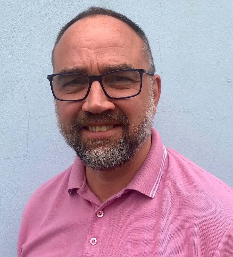 A headshot photo of Nick Hudd