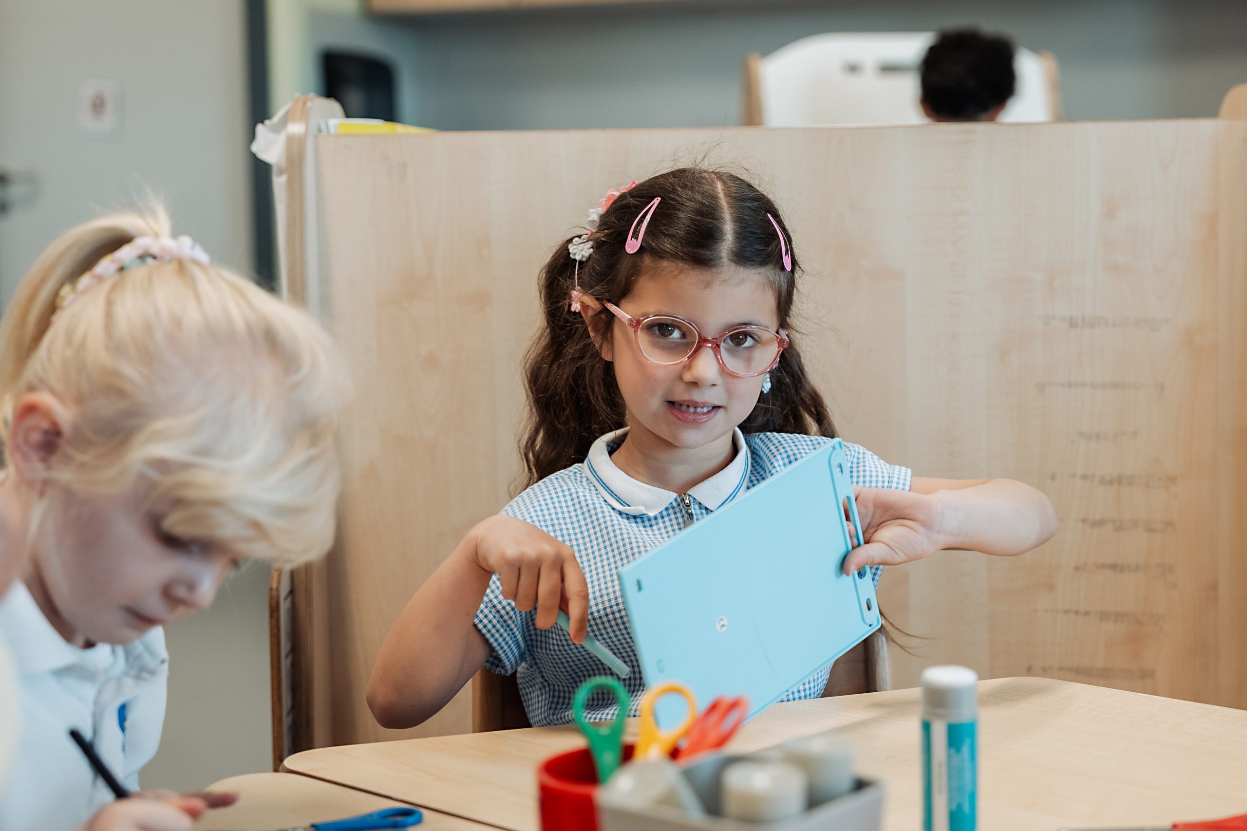Two primary school children doing arts and crafts